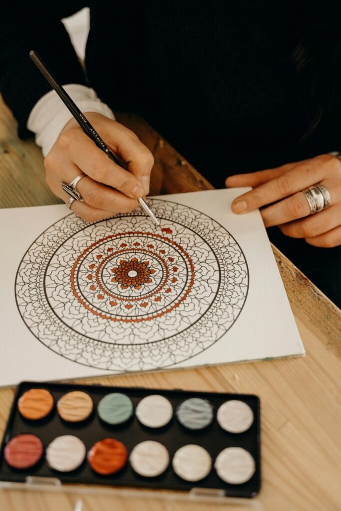 adult coloring book page and paint. pexels.